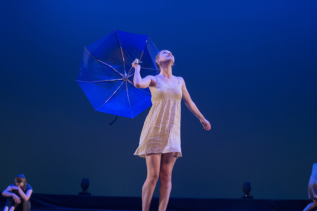 dancer on stage wiith umbrella